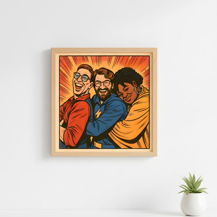 Framed artwork of three people hugging on a white wall with a small plant in the corner.