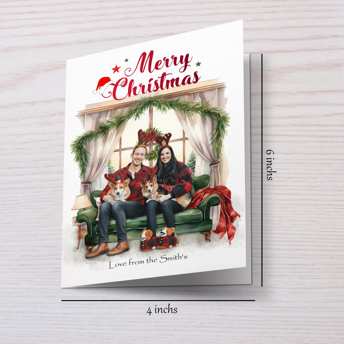 Christmas card with a couple and two dogs sitting on a couch, surrounded by festive decorations.