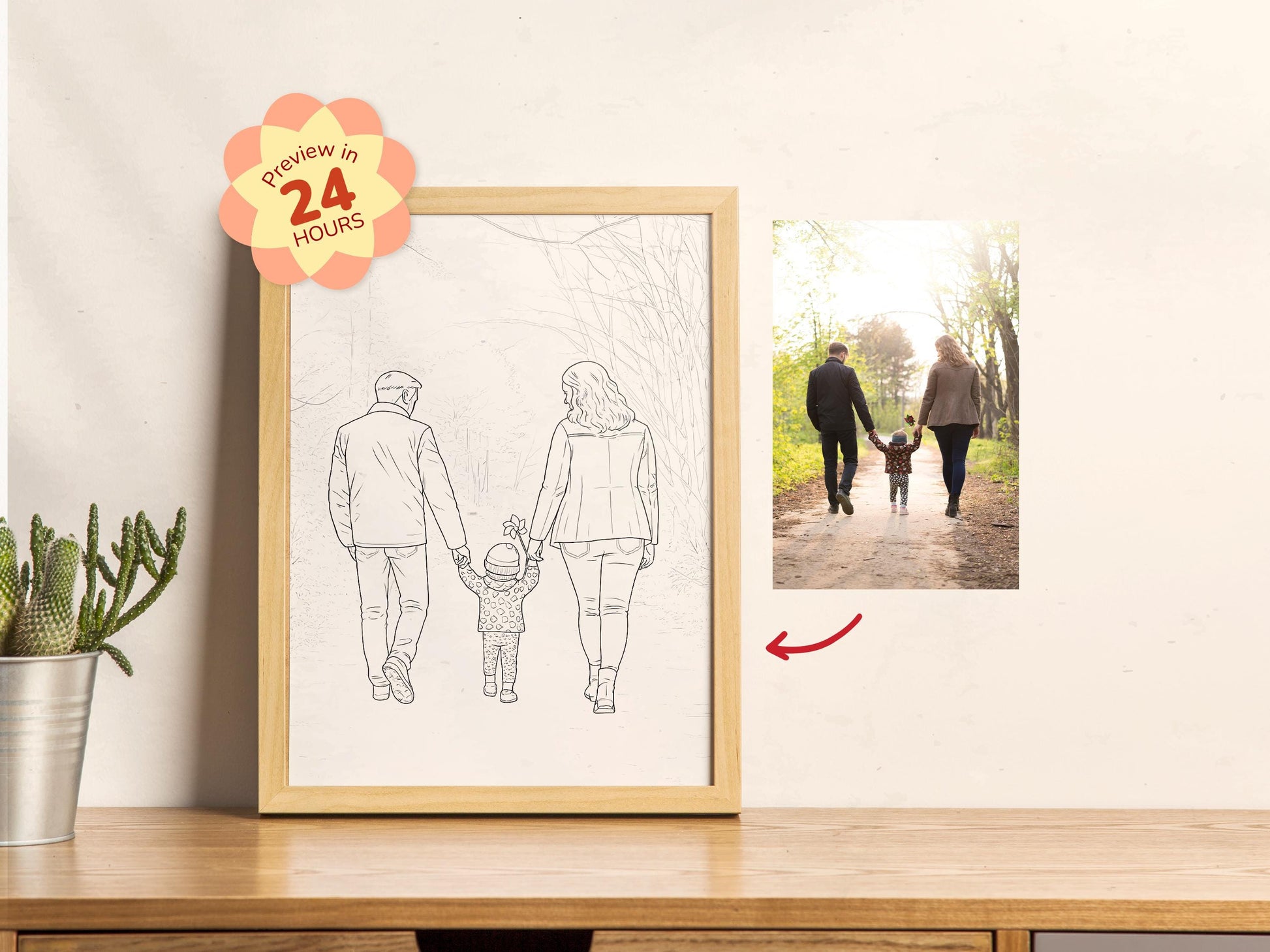Framed line drawing of a family on a table next to a photo of a real family walking outdoors.