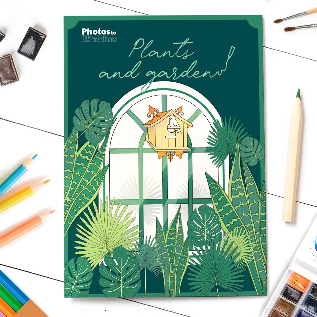 Coloring book cover with plants and garden design on a white surface with art supplies.