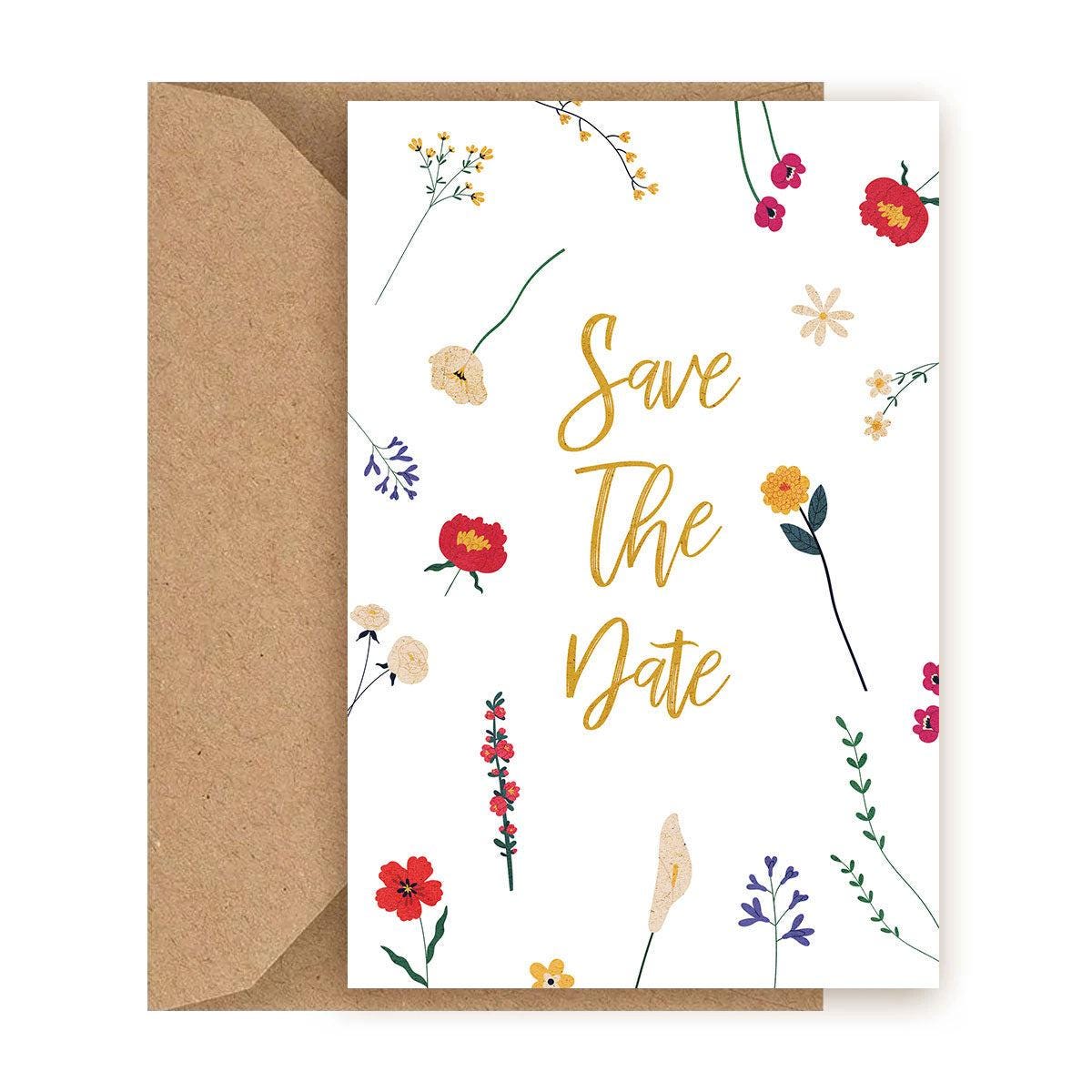 Greeting card with 'Save The Date' text and floral designs on a white background