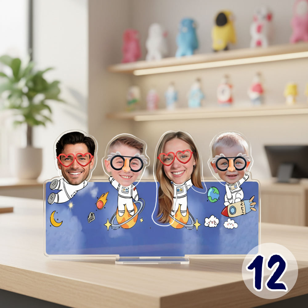 Personalized family bobblehead standee with custom faces in a cute astronaut space theme on acrylic base