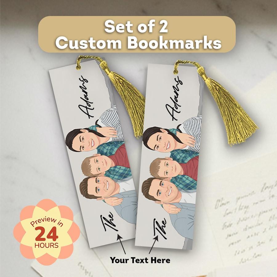 Set of 2 custom bookmarks with a family illustration and gold tassels on a marble surface.