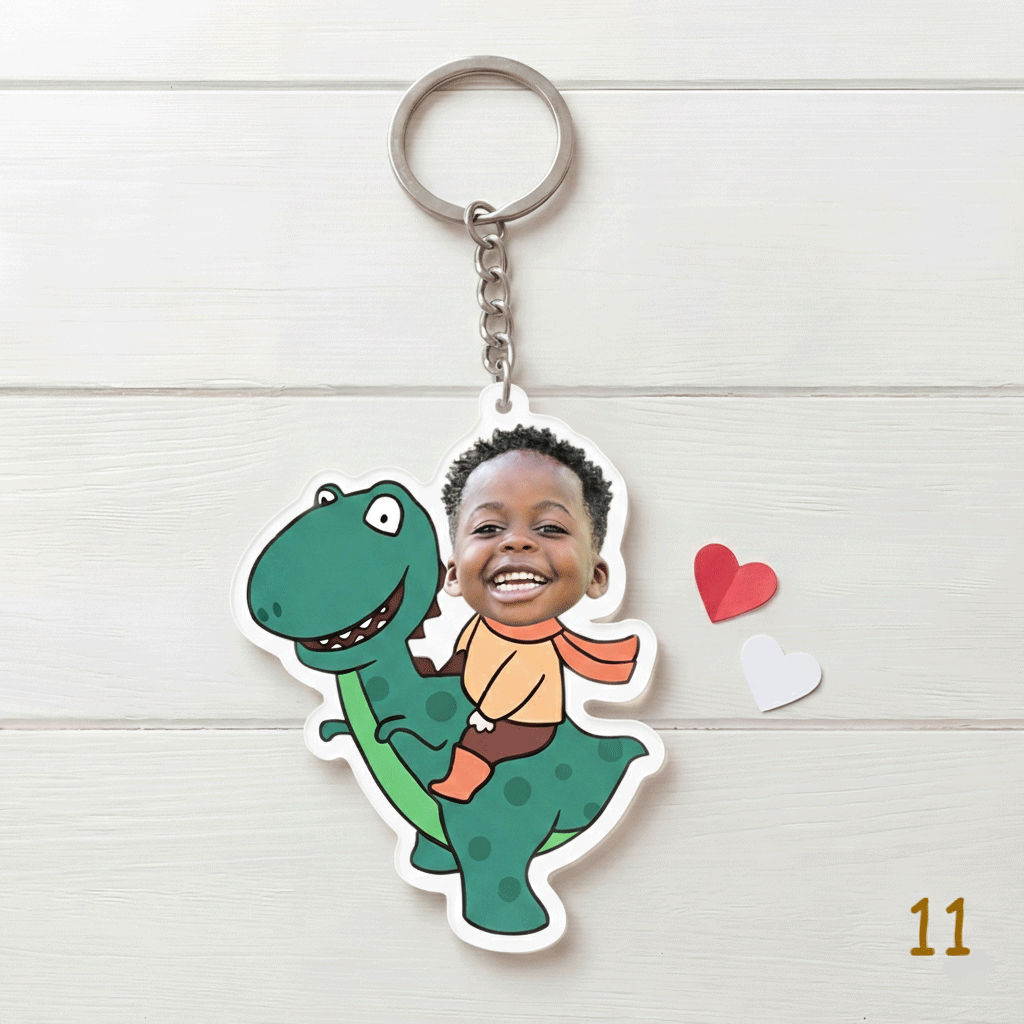 Keychain with a cartoon dinosaur and child design on a white background