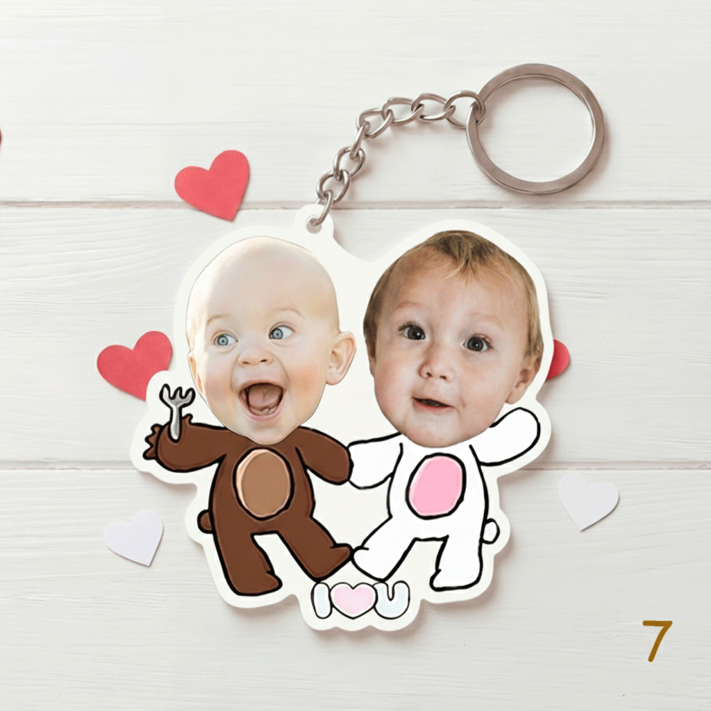 Keychain with two children's faces on a white background