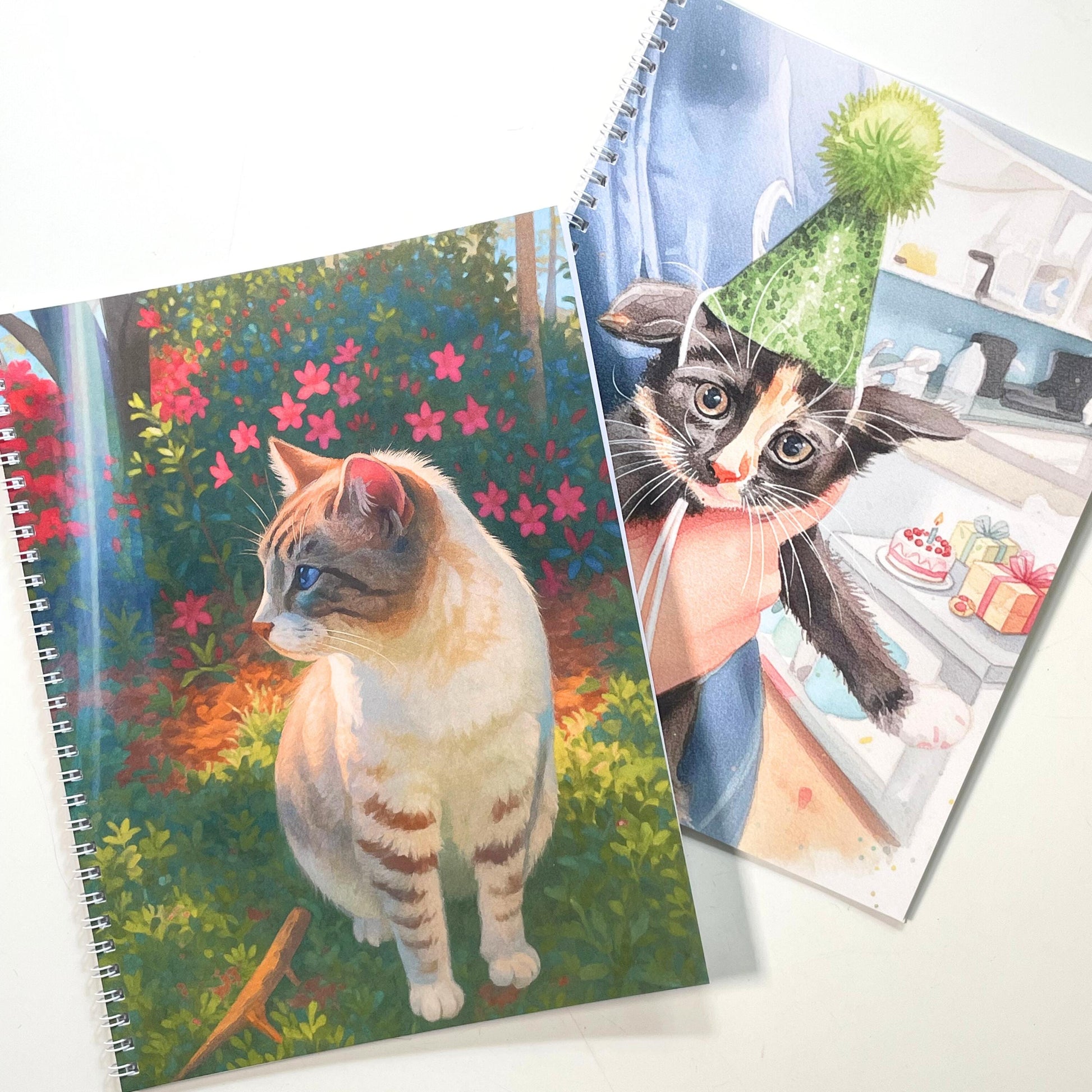 Three coloring books with cat-themed covers