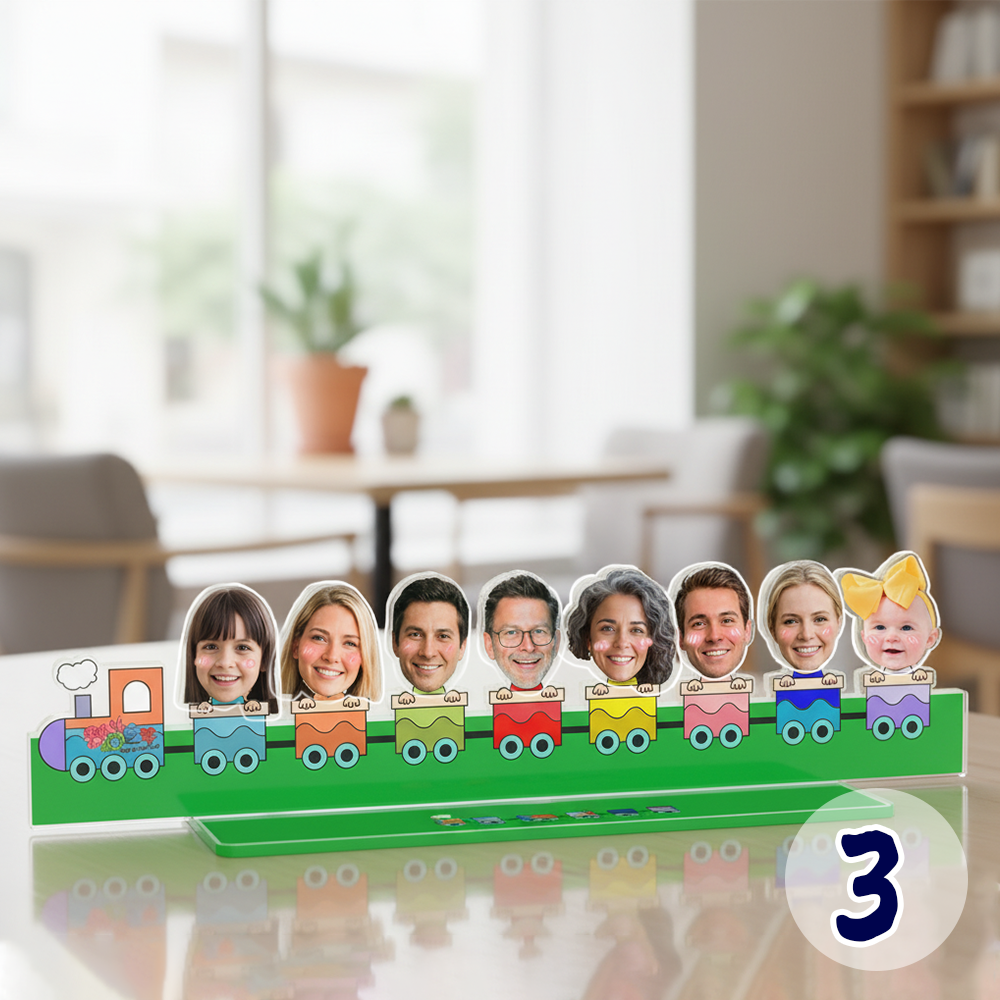 Personalized family bobblehead standee featuring custom faces on a colorful cartoon train acrylic base