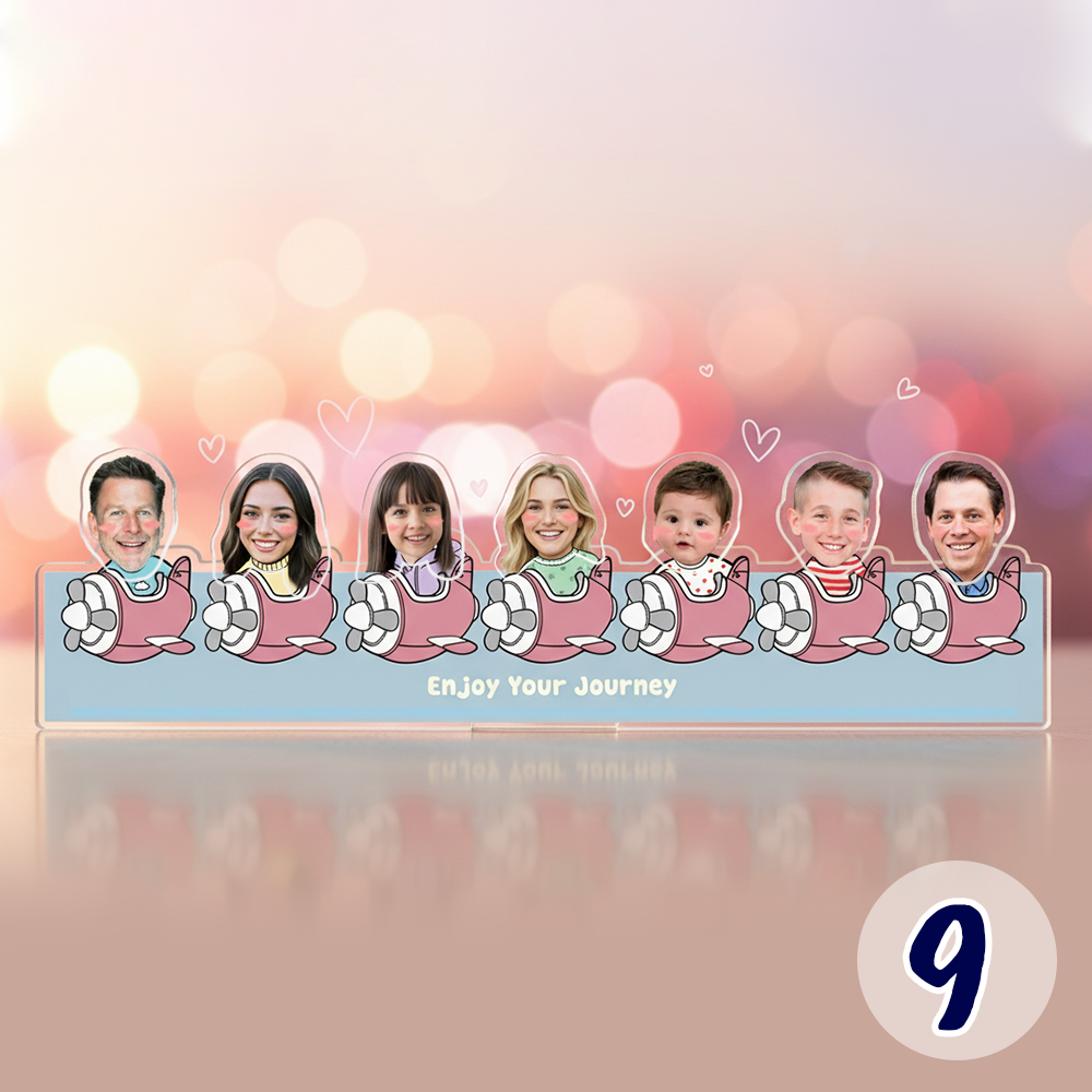 Personalized family bobblehead standee with custom faces in a cute travel-themed cartoon design on acrylic base