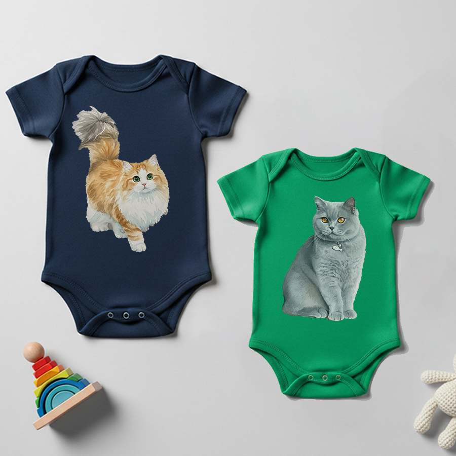 Two baby bodysuits with cat illustrations on a light gray background