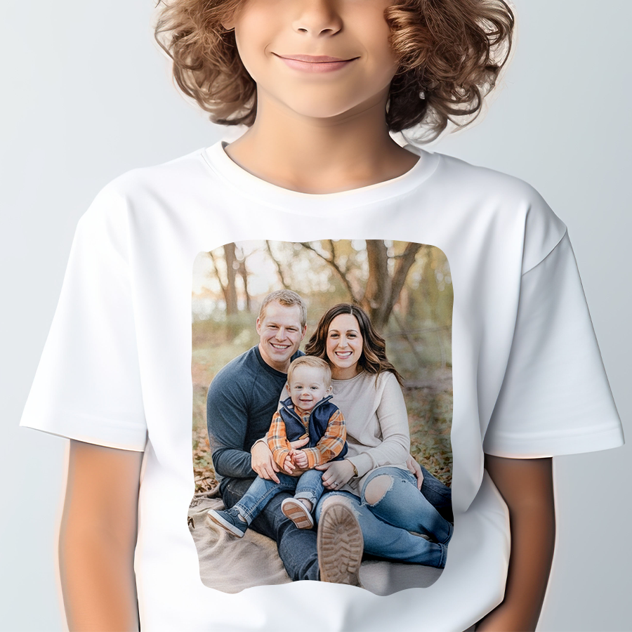 Child wearing a white t-shirt with a printed family photo on a plain background